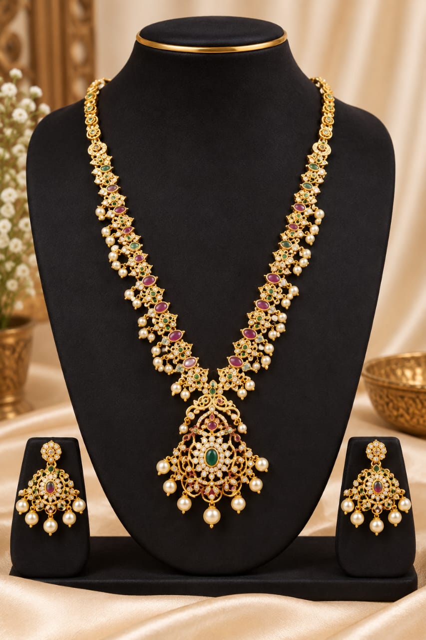 Long necklace set with green and pink stones and matching earrings