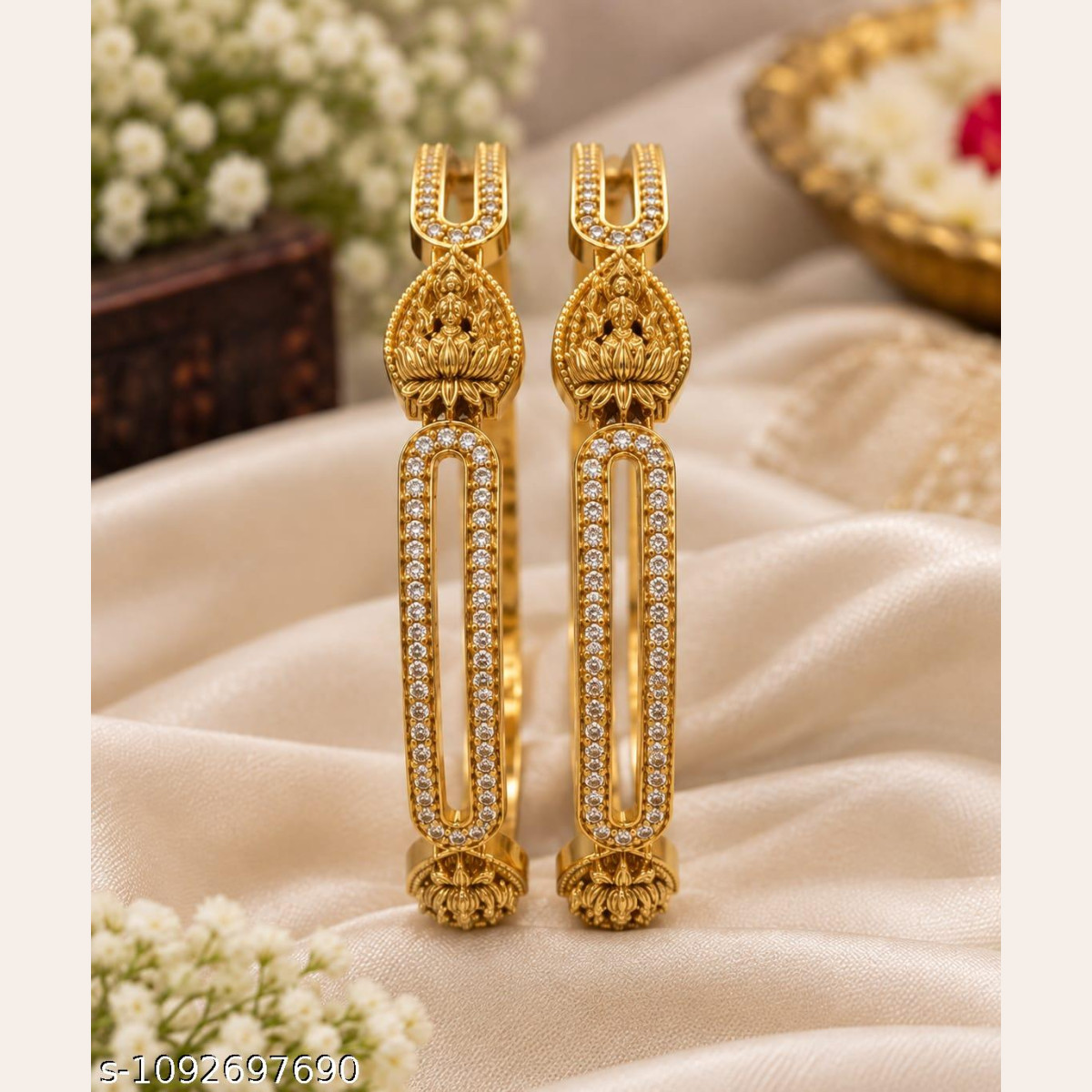 Elegant CZ bangle set with floral and elongated design.