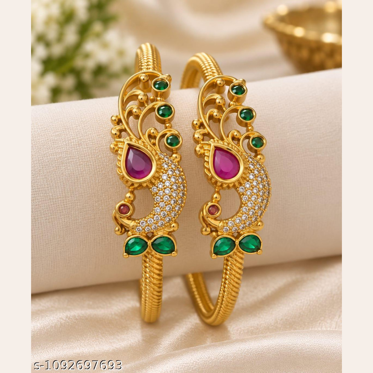Elegant CZ bangles featuring intricate peacock design with colorful stones.