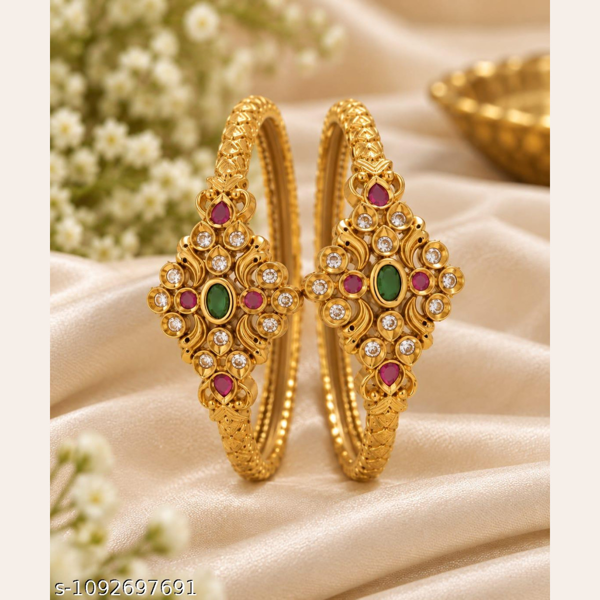Elegant CZ kada bangles with colorful stones and intricate design.